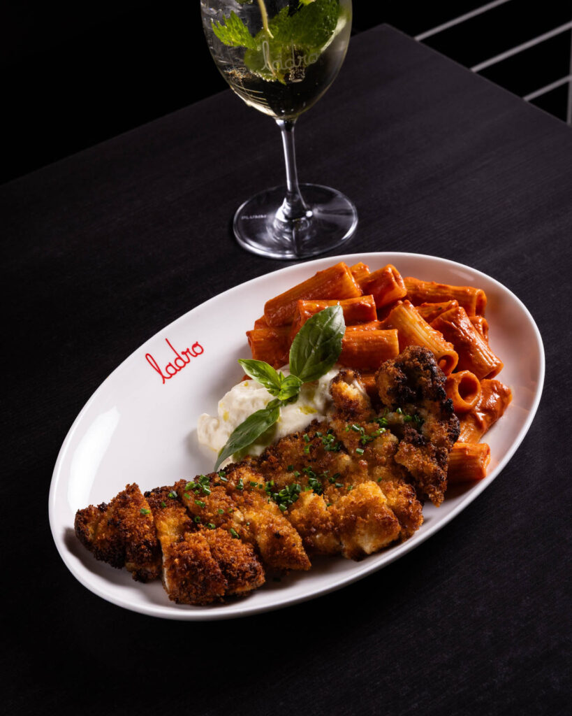 Breaded chicken with rigatoni, mozzarella, and white wine